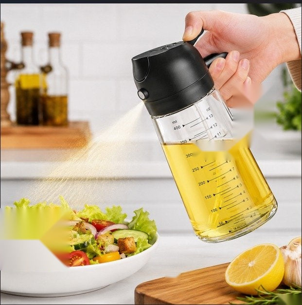 Pouring oil over a salad with the glass dispenser