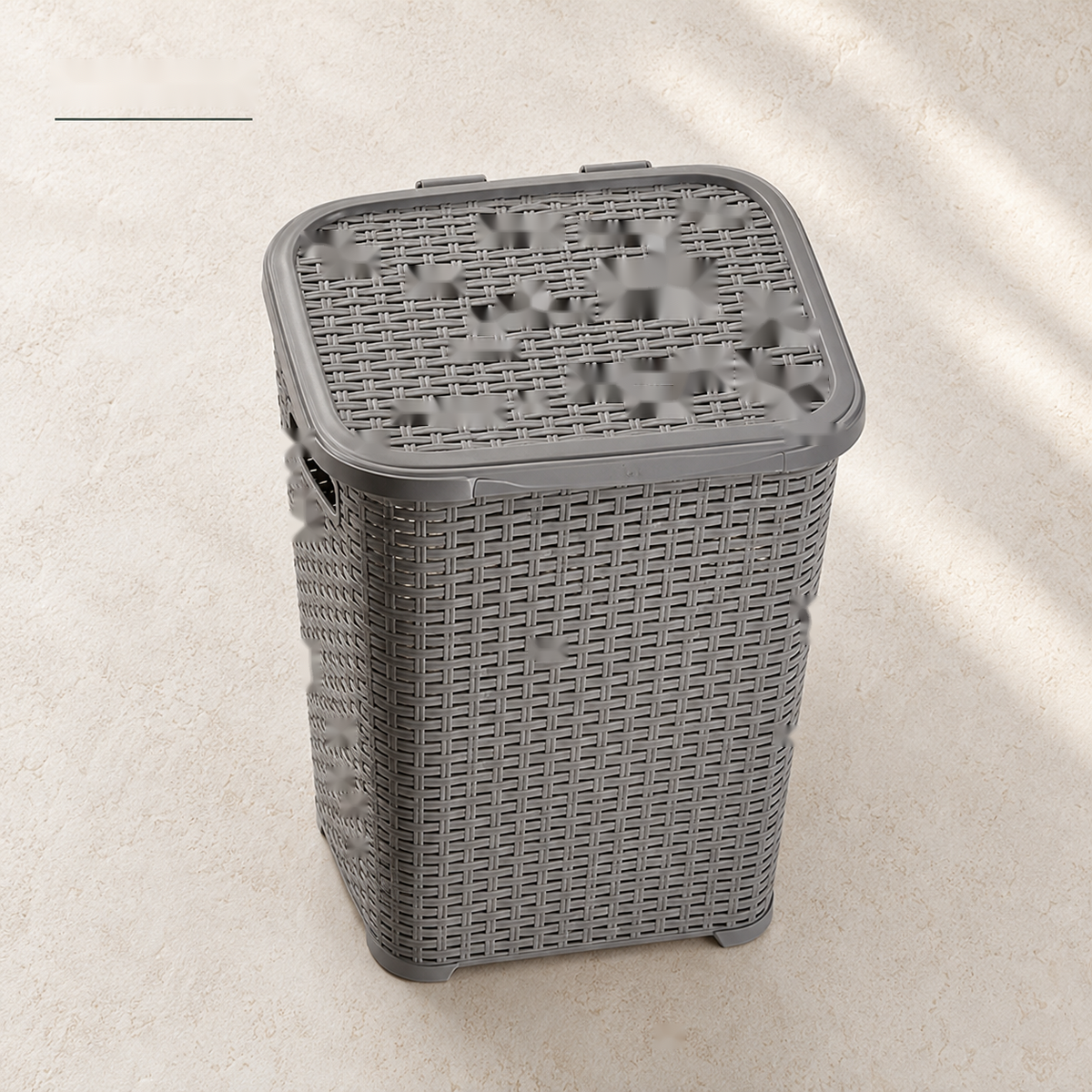 Closed grey laundry basket with fitted lid